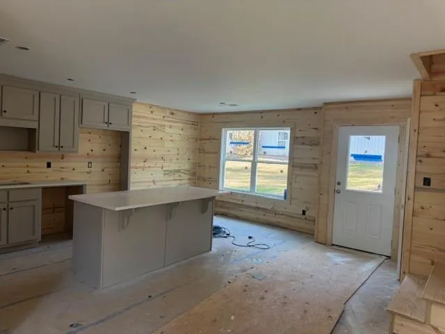 a kitchen with stainless steel appliances a stove a refrigerator sink and cabinets