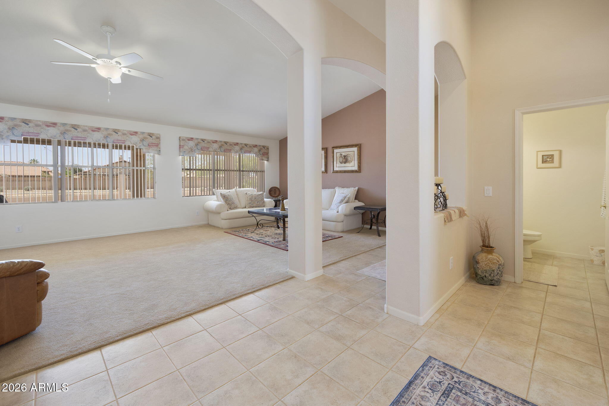 12435 West Monte Vista Road Avondale, AZ 85392 - Photo 10 of 69 a living room with furniture and a window