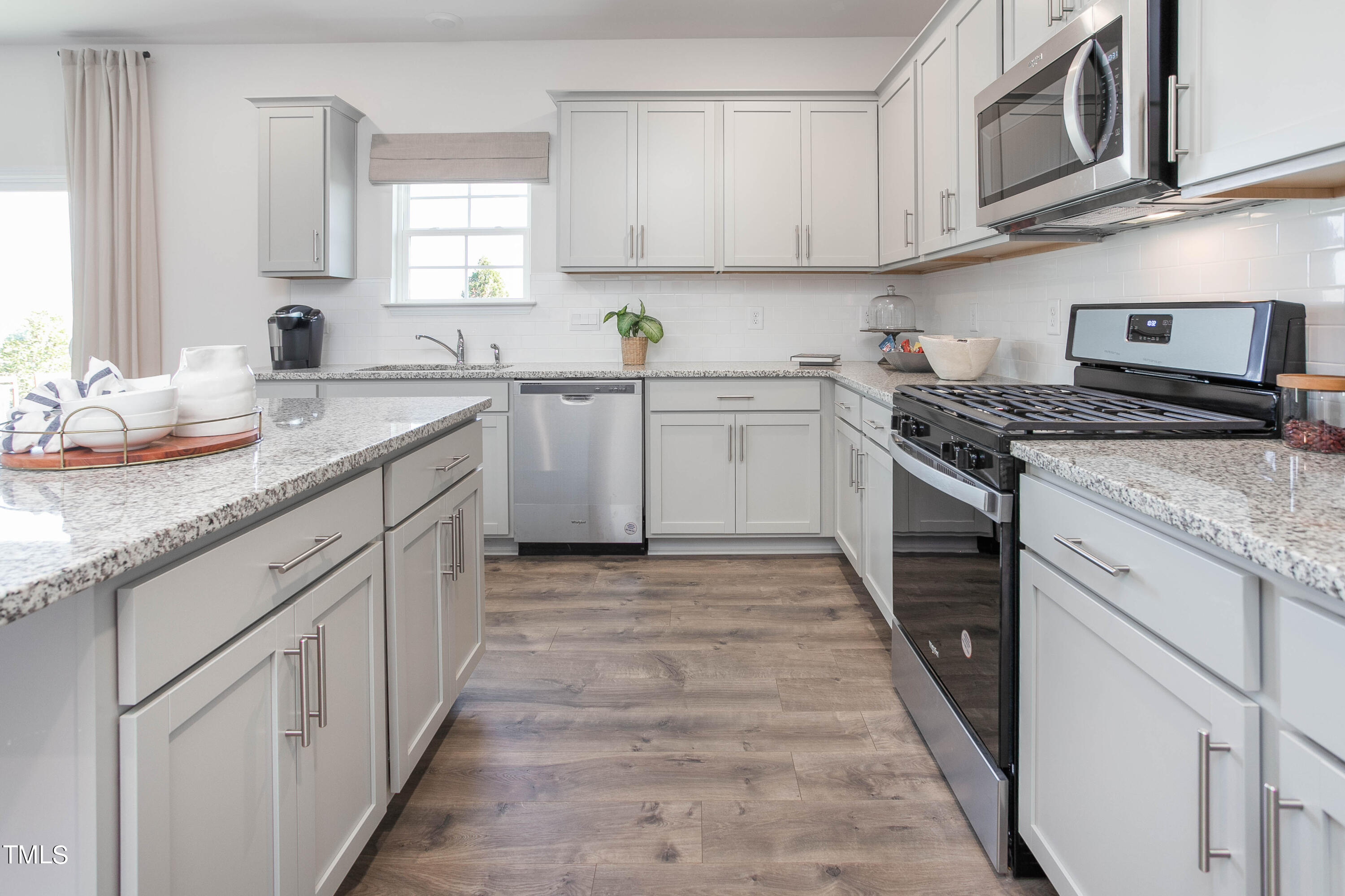 2017 Delta Road Vass, NC 28394 - Photo 17 of 38 a kitchen with stainless steel appliances granite countertop a stove sink and cabinets
