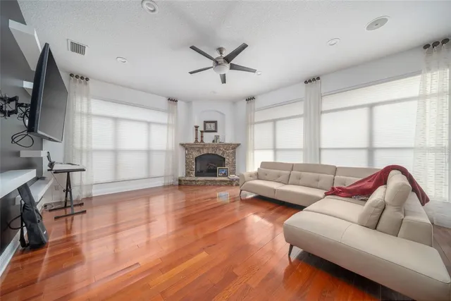a living room with furniture and a fireplace