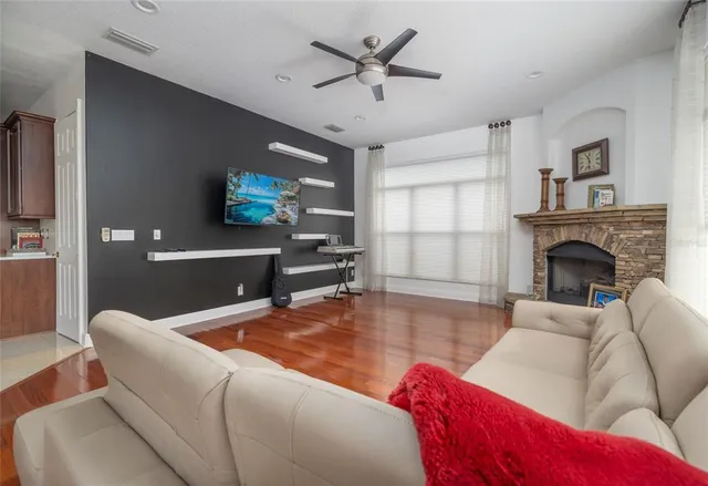 a living room with furniture and a fireplace