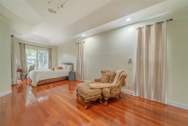 a bedroom with furniture and a window