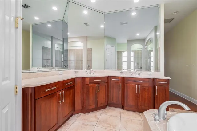 a bathroom with a sink and mirror