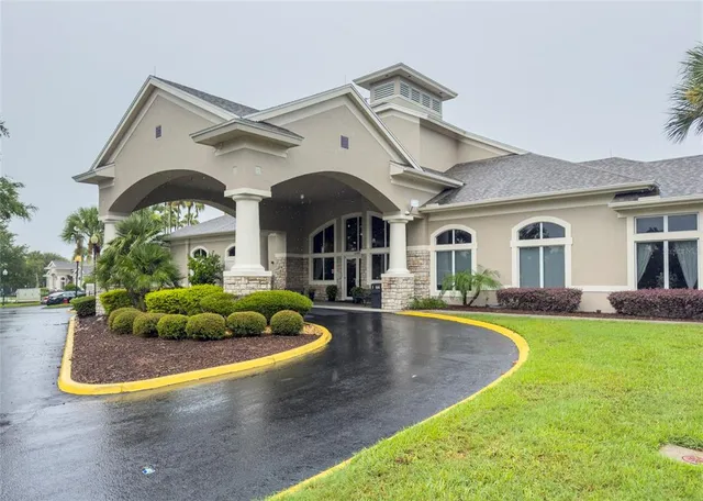 a view of a swimming pool with chairs
