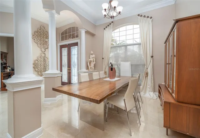 a dining room with furniture and window