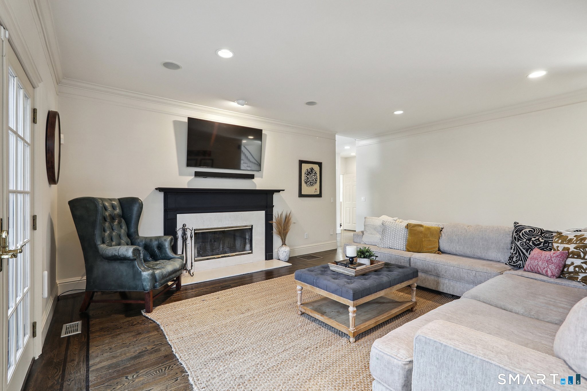 100 Chestnut Hill Road Ridgefield, CT 06877 - Photo 12 of 40 a living room with furniture fireplace and flat screen tv