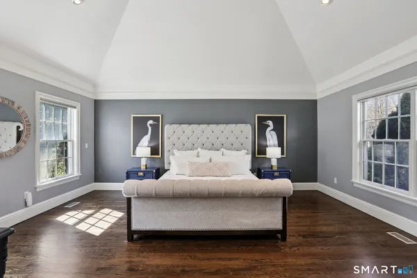 a bedroom with a bed and window