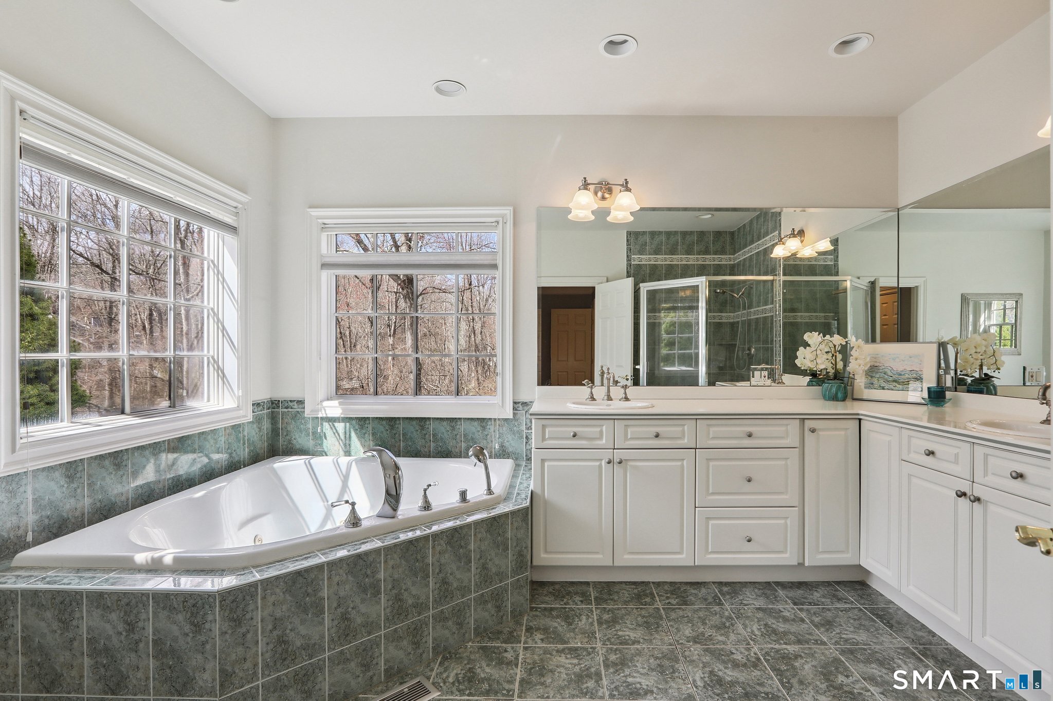 100 Chestnut Hill Road Ridgefield, CT 06877 - Photo 16 of 40 a spacious bathroom with a large tub sink and double vanity