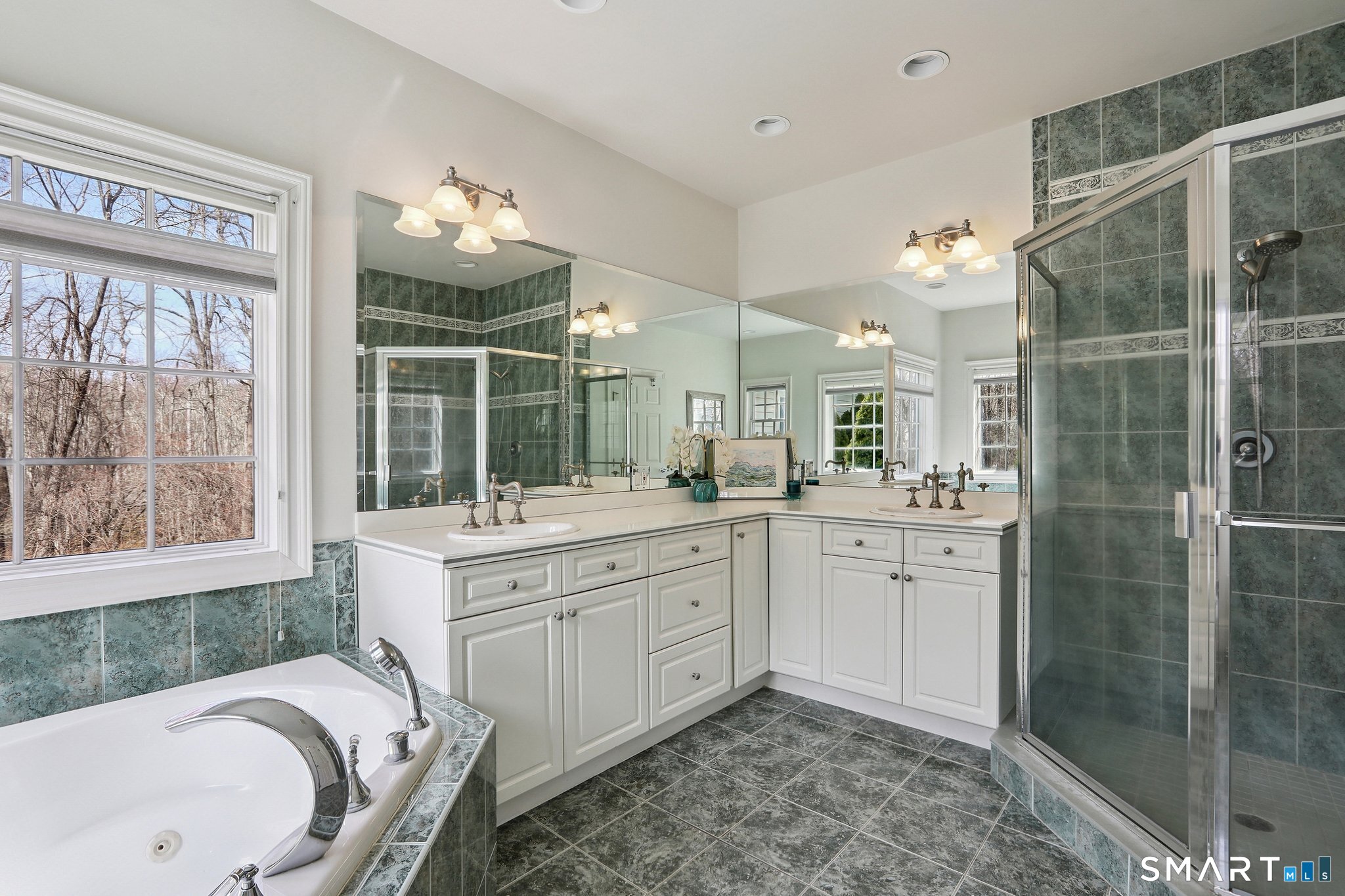 100 Chestnut Hill Road Ridgefield, CT 06877 - Photo 17 of 40 a spacious bathroom with a sink mirror and a bathtub