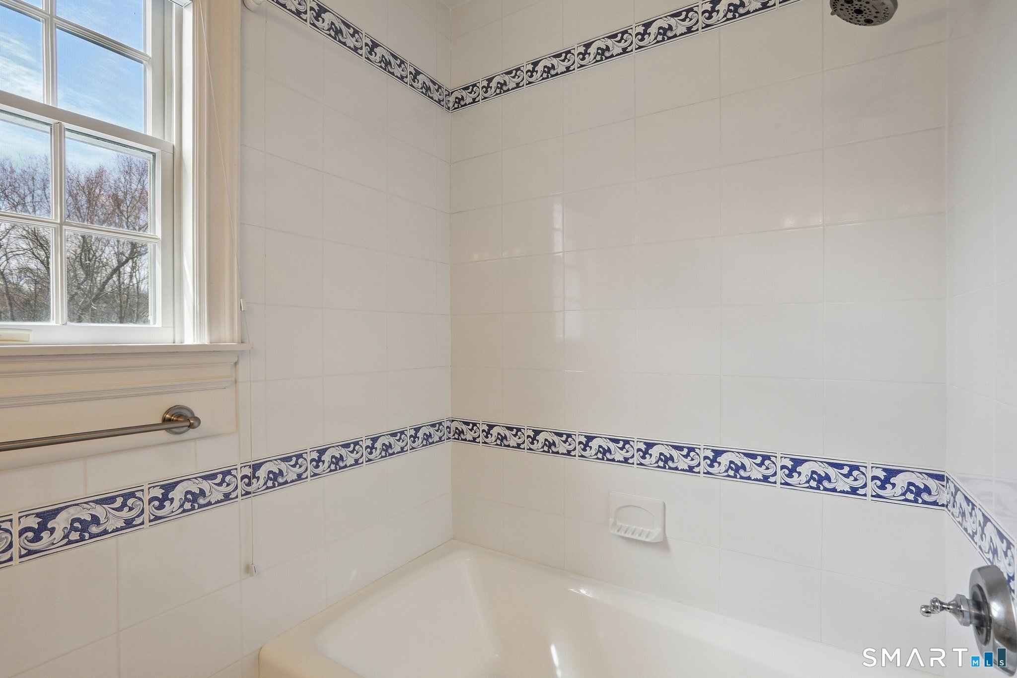 100 Chestnut Hill Road Ridgefield, CT 06877 - Photo 25 of 40 a bathroom with a shower and a window