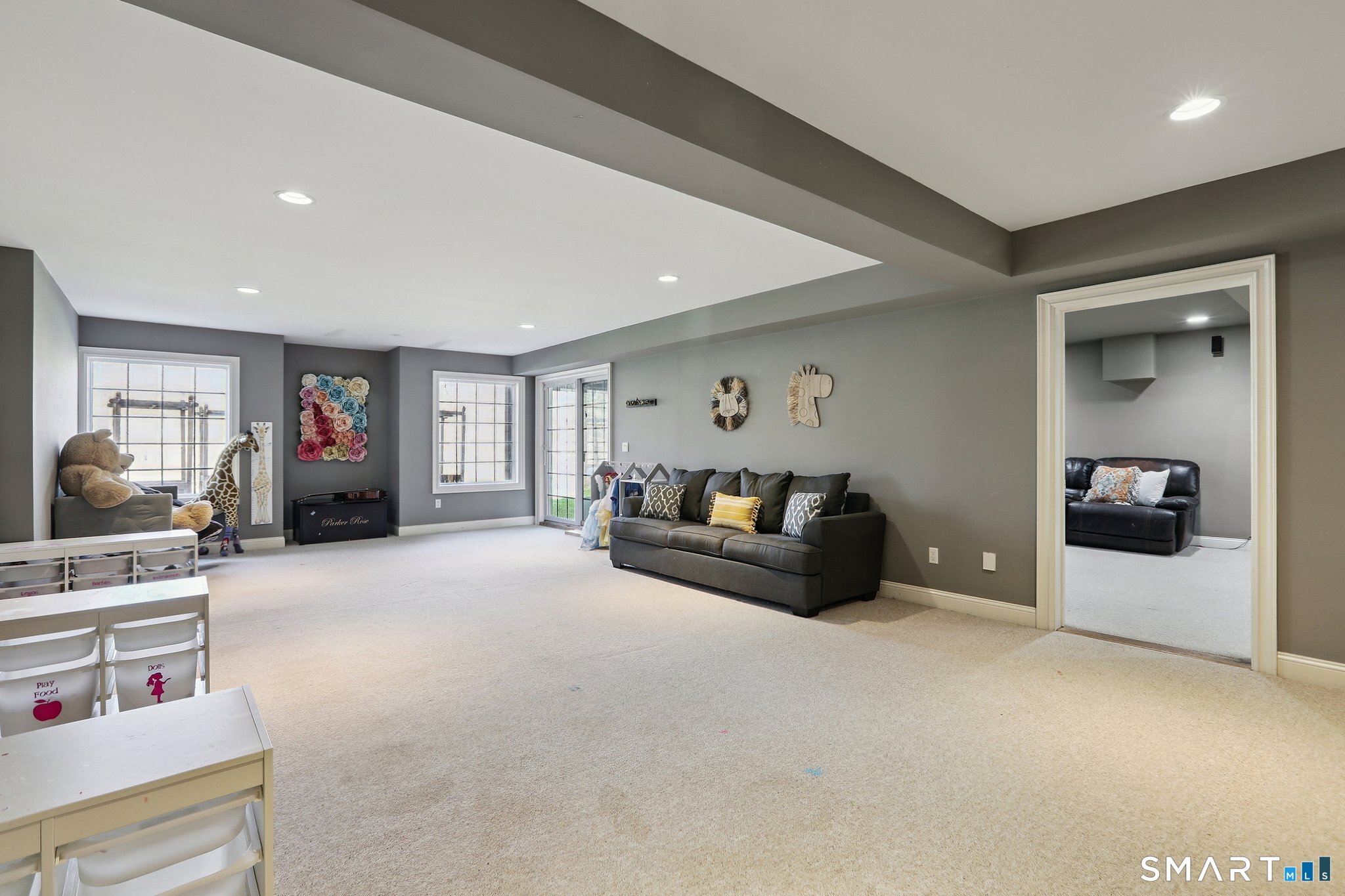 100 Chestnut Hill Road Ridgefield, CT 06877 - Photo 26 of 40 a living room with furniture and a flat screen tv