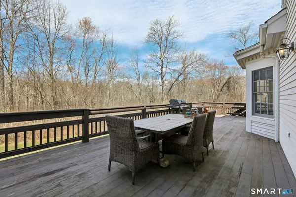 a view of a chairs and table on the deck