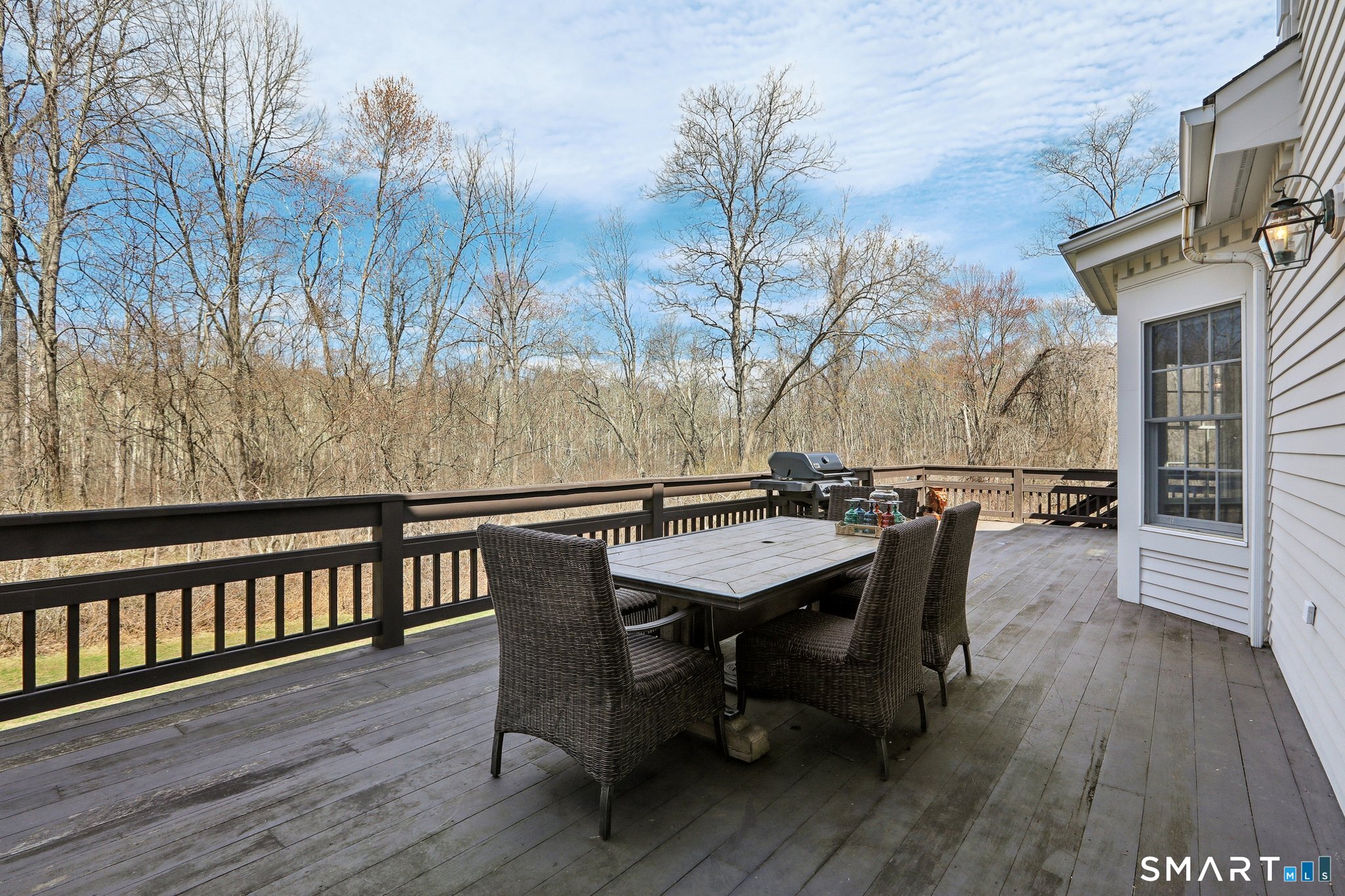 100 Chestnut Hill Road Ridgefield, CT 06877 - Photo 31 of 40 a view of a chairs and table on the deck