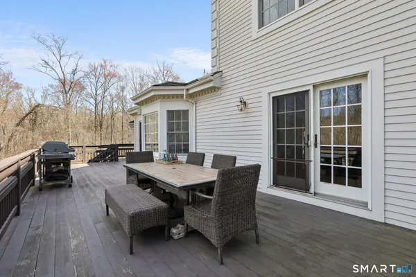 a view of a dinning table and chairs in roof deck