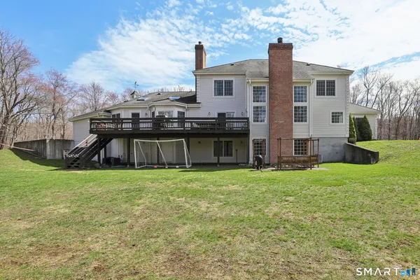 a view of a house with backyard porch and garden