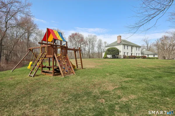 a view of a houses with yard and entertaining space