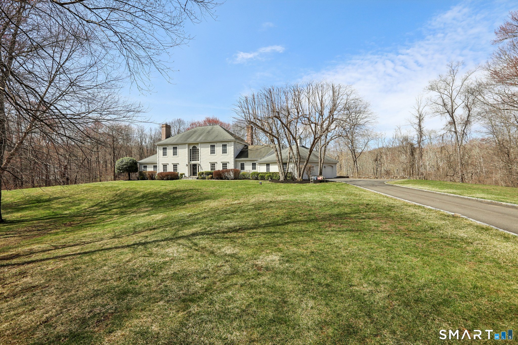 100 Chestnut Hill Road Ridgefield, CT 06877 - Photo 37 of 40 a view of a field with large trees