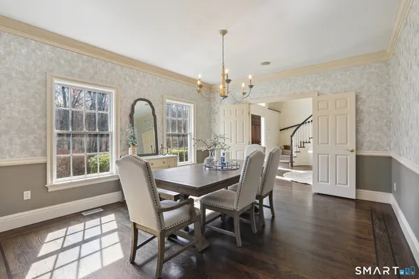 a view of a dining room with furniture window and wooden floor
