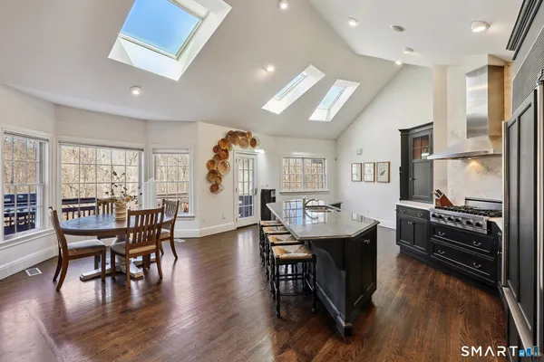 a view of a dining room with furniture and wooden floor