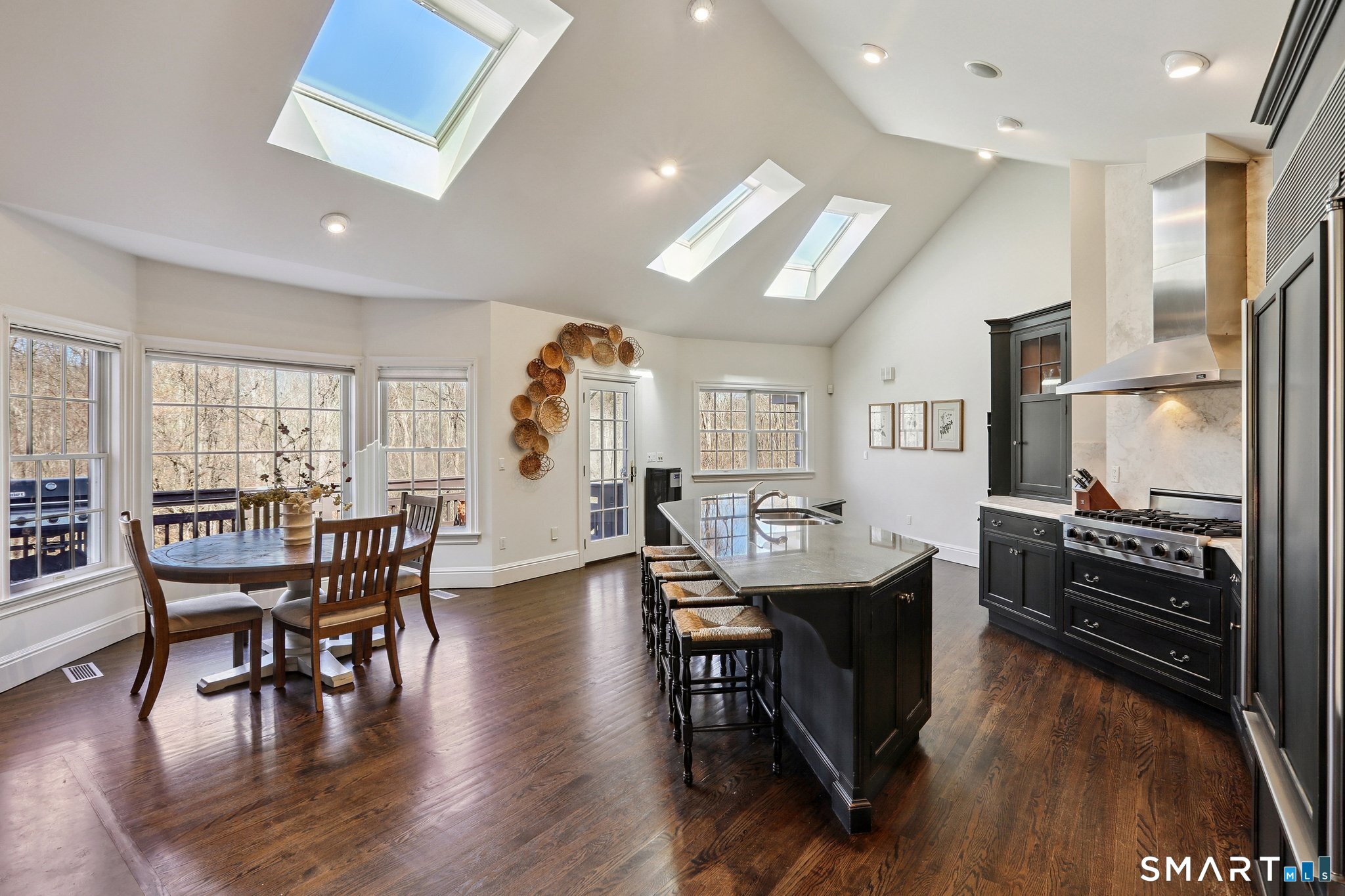 100 Chestnut Hill Road Ridgefield, CT 06877 - Photo 6 of 40 a view of a dining room with furniture and wooden floor