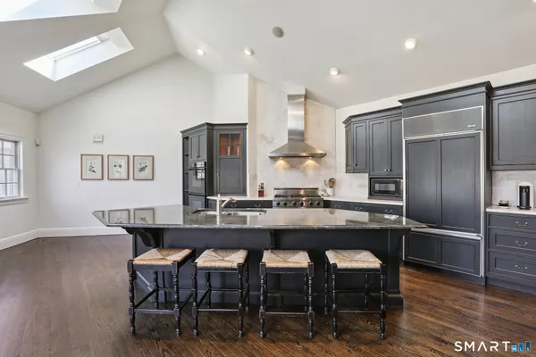 a kitchen with a table and chairs in it