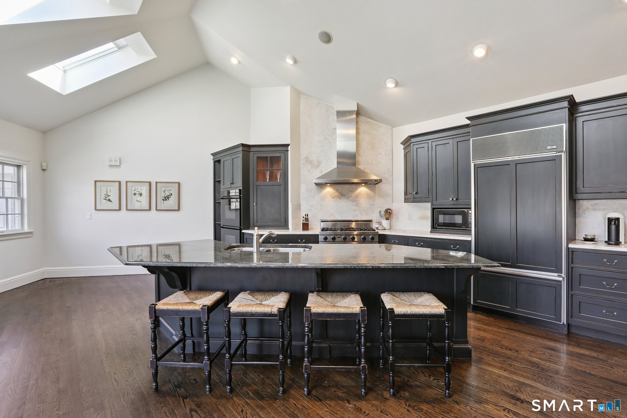 100 Chestnut Hill Road Ridgefield, CT 06877 - Photo 7 of 40 a kitchen with a table and chairs in it