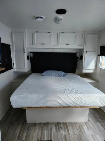 a view of bedroom with wooden floor