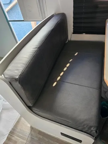 a balcony with furniture and wooden floor