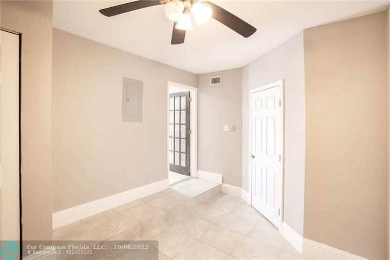 Winston Park Coconut Creek, FL 33073 - Photo 13 of 35 a view of a big room with wooden floor and windows in a room