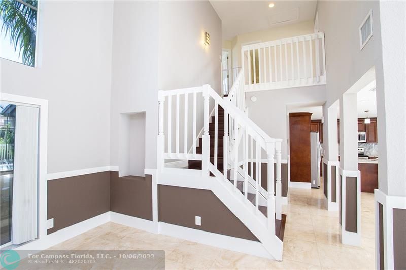 Winston Park Coconut Creek, FL 33073 - Photo 16 of 35 a view of entryway and hall with wooden floor