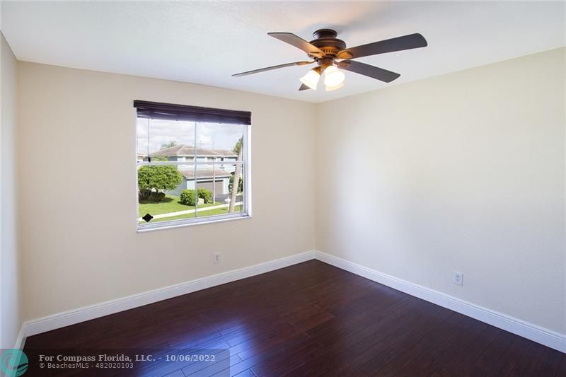 Winston Park Coconut Creek, FL 33073 - Photo 17 of 35 a view of an empty room with wooden floor and a window