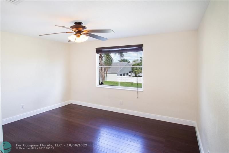 Winston Park Coconut Creek, FL 33073 - Photo 19 of 35 a view of an empty room with wooden floor and a window