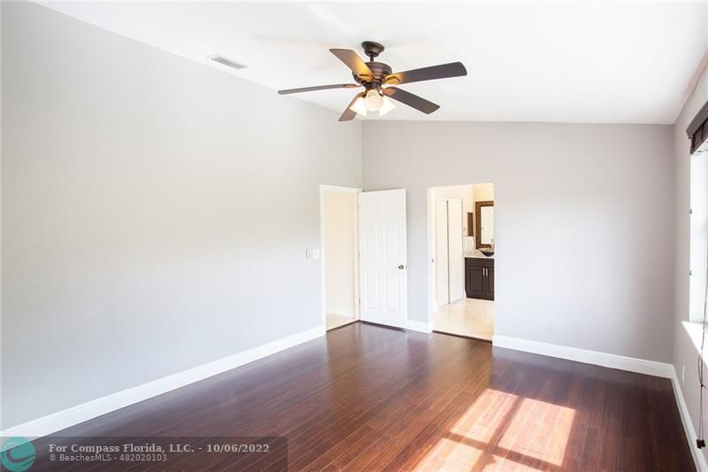 Winston Park Coconut Creek, FL 33073 - Photo 24 of 35 a view of an empty room with wooden floor and a window
