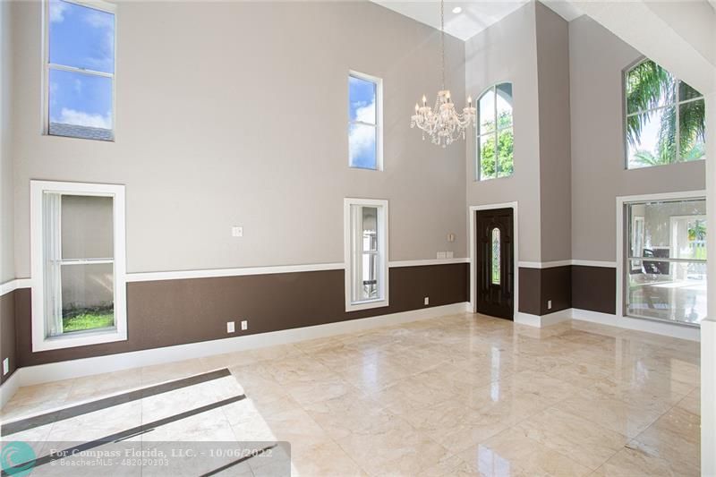 Winston Park Coconut Creek, FL 33073 - Photo 3 of 35 a view of an empty room with window and cabinet