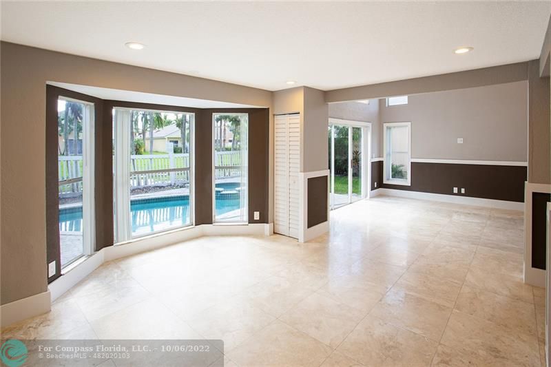 Winston Park Coconut Creek, FL 33073 - Photo 9 of 35 a view of an empty room with a fireplace and a large window