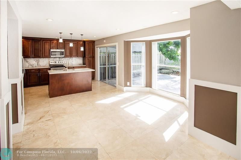 Winston Park Coconut Creek, FL 33073 - Photo 10 of 35 a large white kitchen with a large window