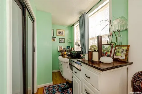 a bathroom with a sink mirror and a window