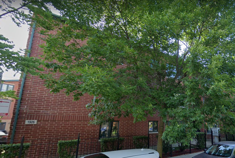 a view of a house with a tree