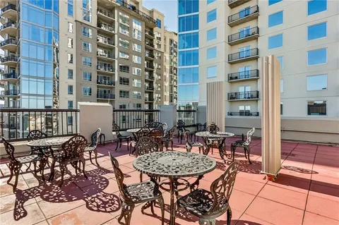 a view of a dinning table and chairs in the patio