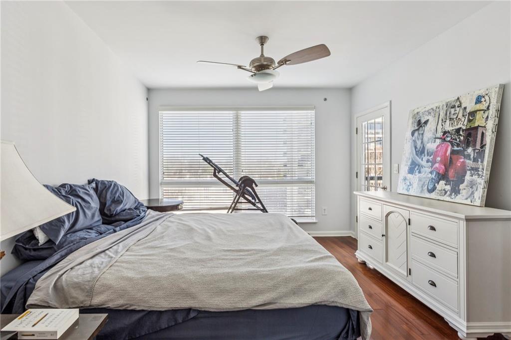 275 13th Street Northeast, Unit 707 Atlanta, GA 30309 - Photo 5 of 17 a living room with furniture and a window