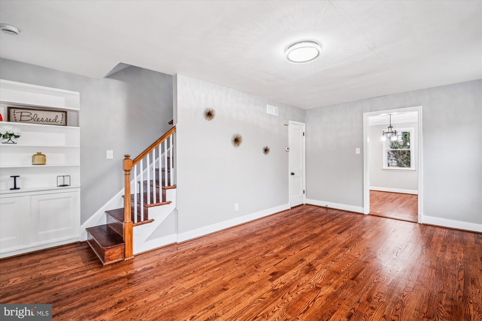 5408 14th Place Hyattsville, MD 20782 - Photo 22 of 49 a view of an empty room with wooden floor and a window