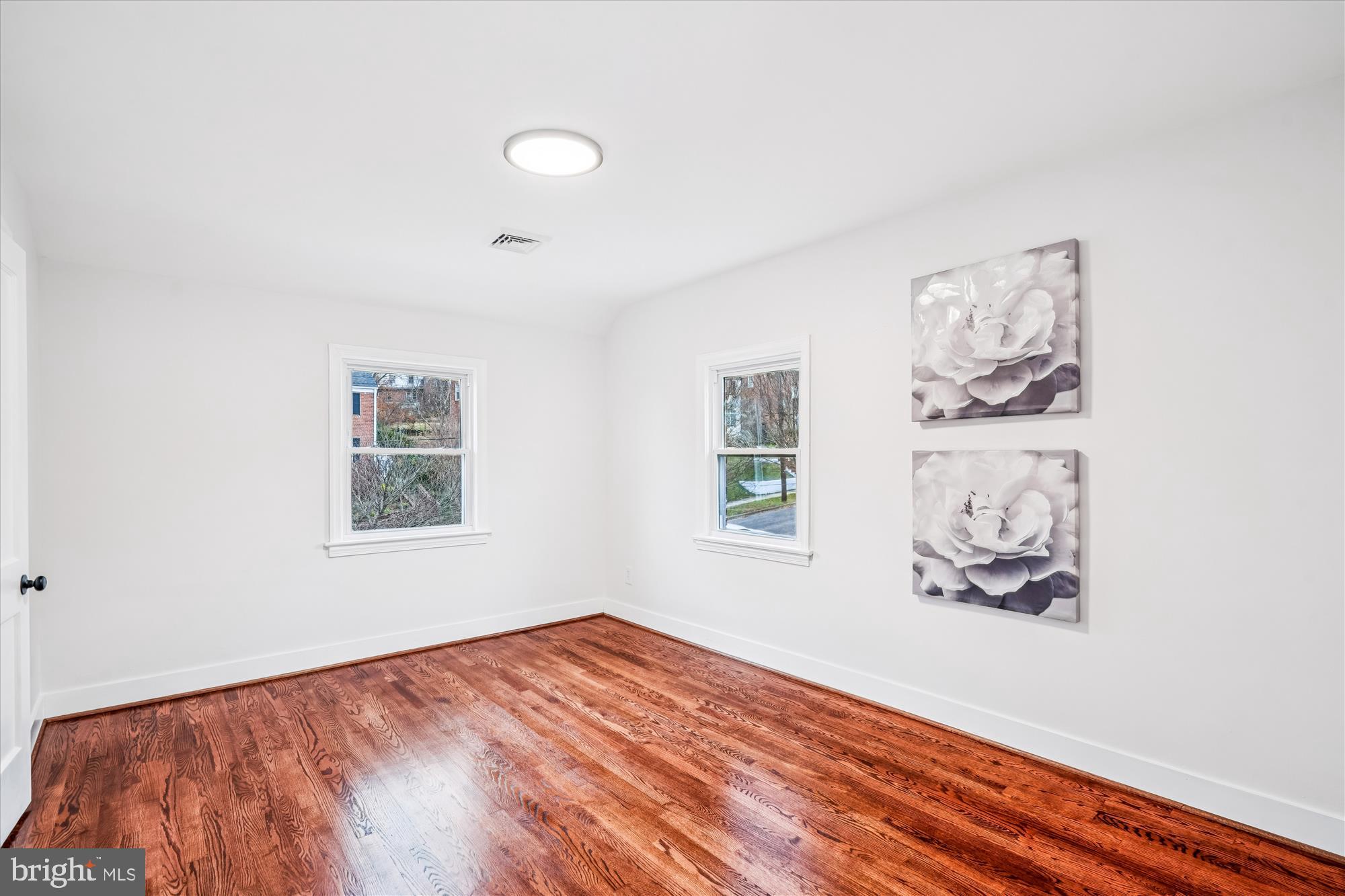 5408 14th Place Hyattsville, MD 20782 - Photo 24 of 49 a view of a bedroom with wooden floor and window