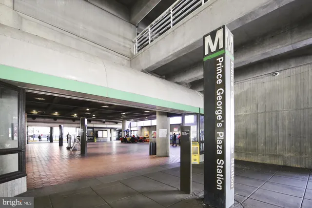 a front view of a building with sitting area