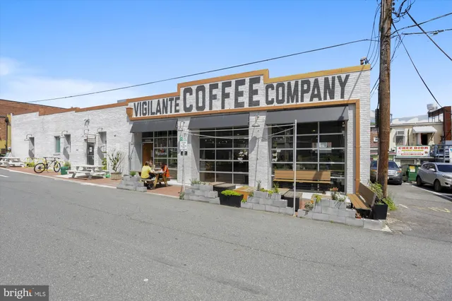a view of a house with door and a tree