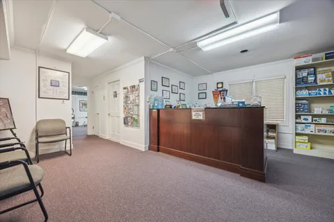 a view of a livingroom with furniture and cabinet