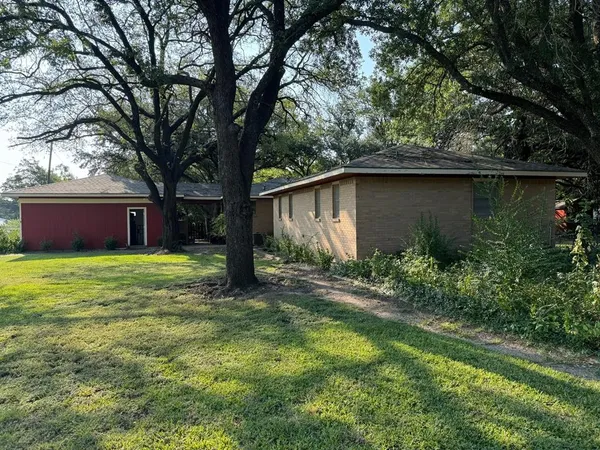 a house view with a garden space