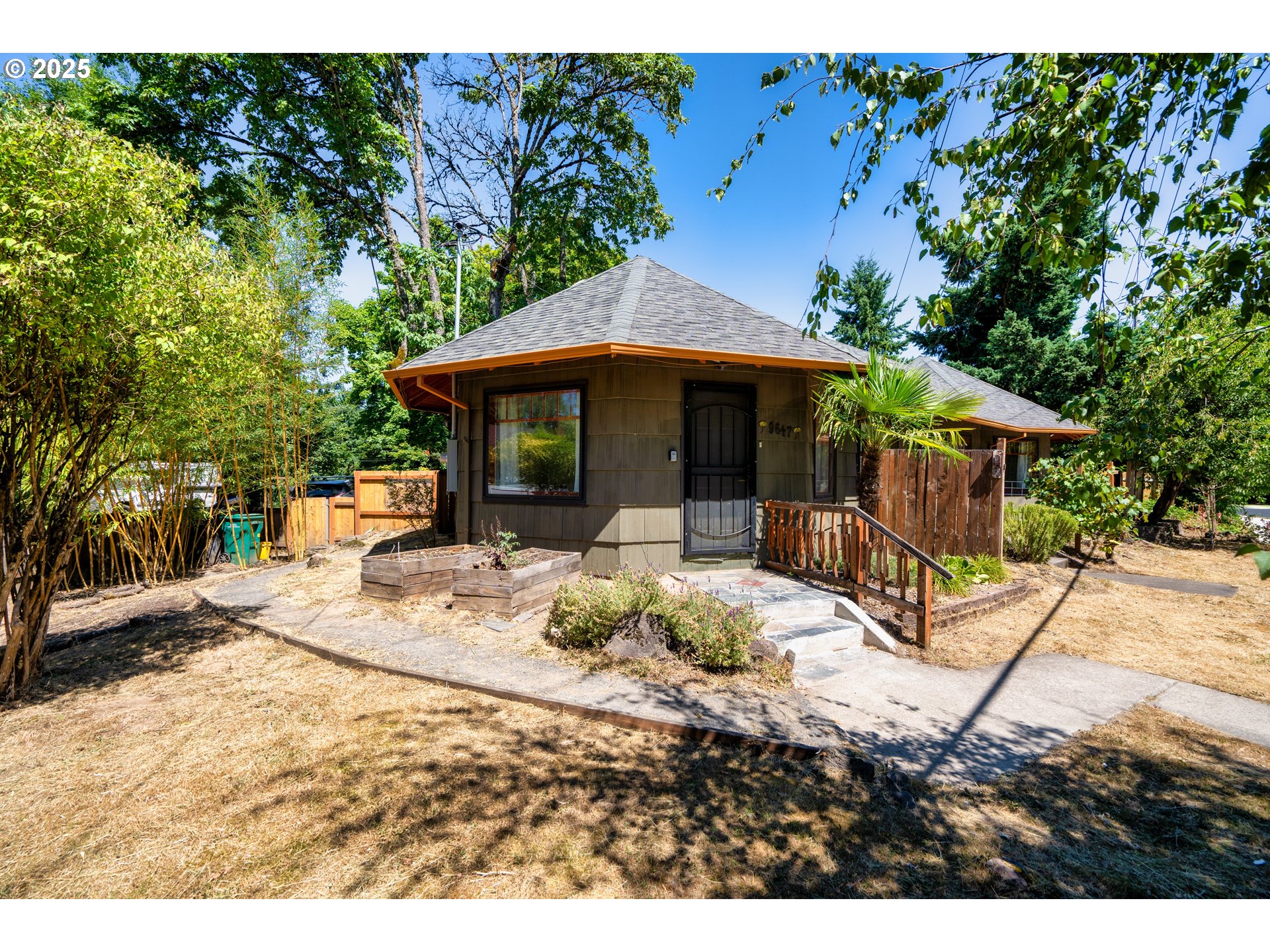a view of a house with backyard porch and sitting area