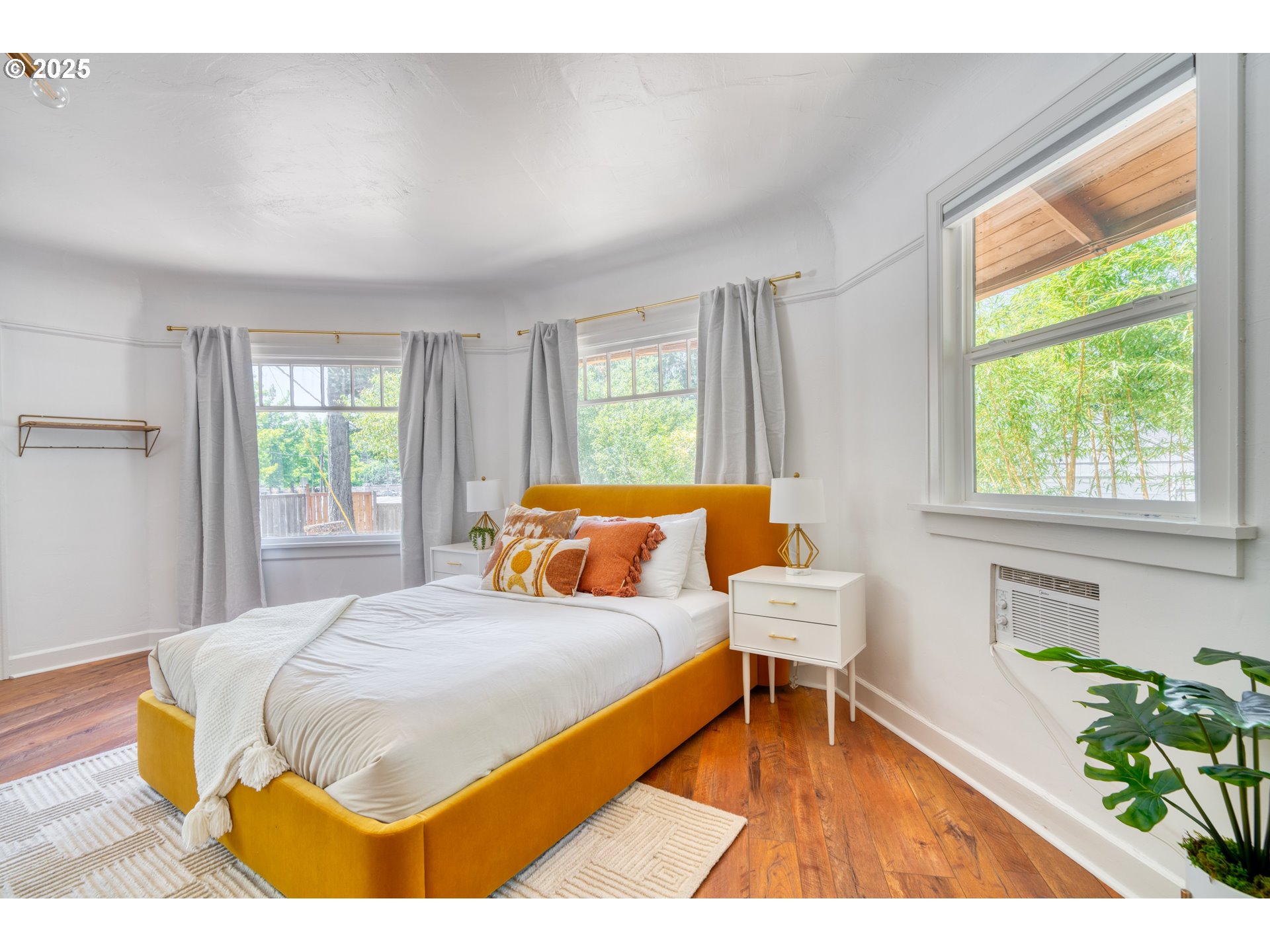 9647 Southwest Capitol Highway Portland, OR 97219 - Photo 17 of 33 a bedroom with a bed and a window
