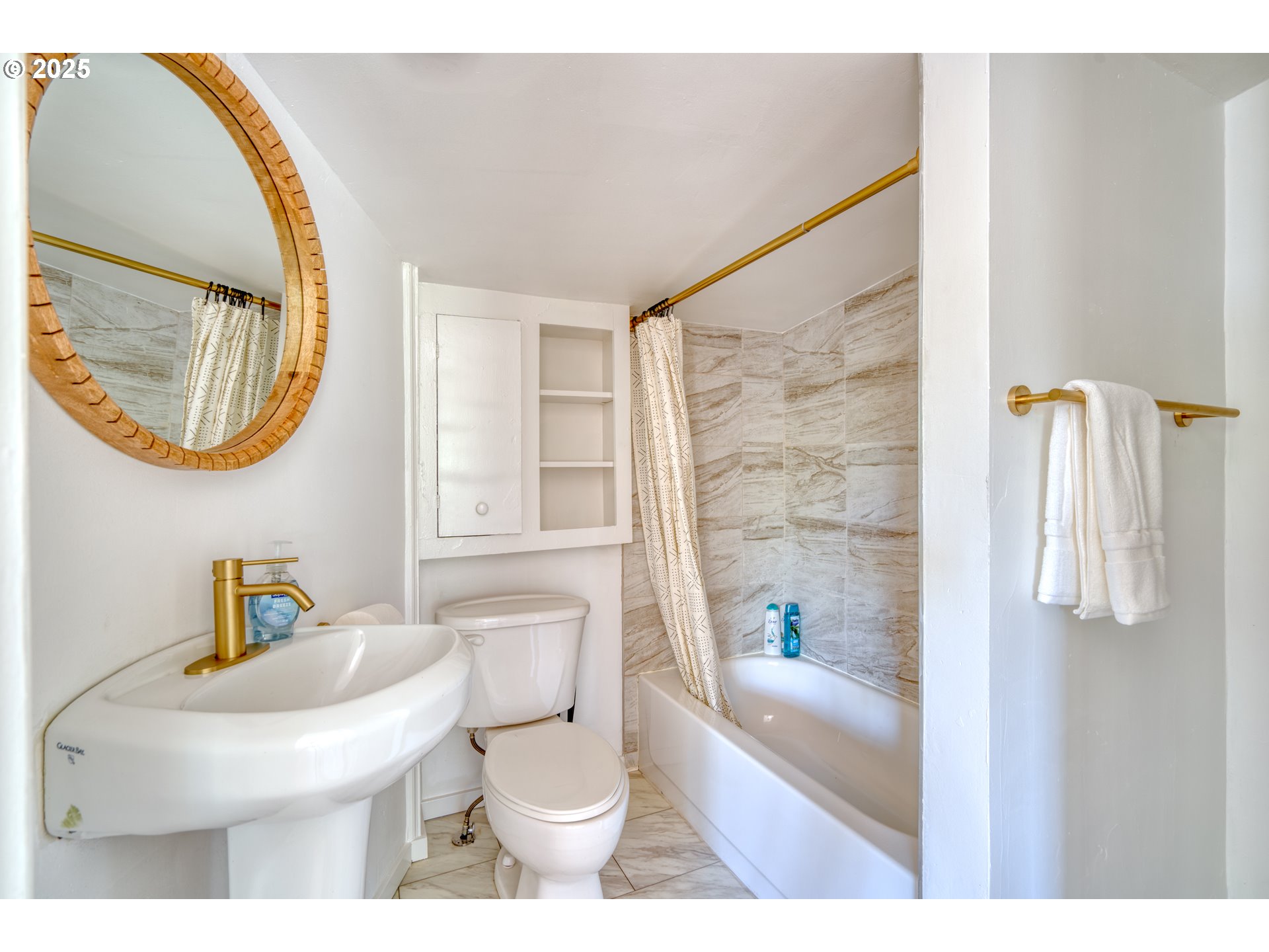 9647 Southwest Capitol Highway Portland, OR 97219 - Photo 20 of 33 a bathroom with a sink a toilet and a mirror