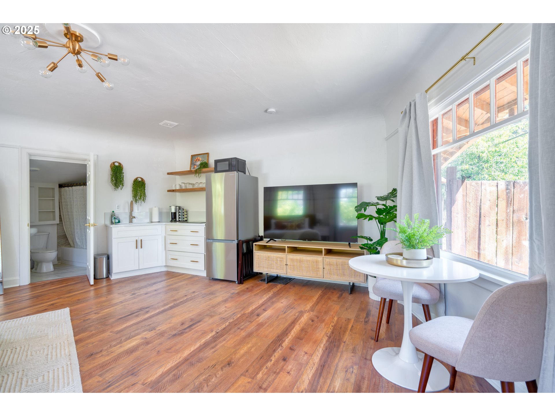 9647 Southwest Capitol Highway Portland, OR 97219 - Photo 21 of 33 a living room with furniture and a flat screen tv